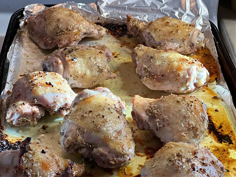 roasted lemon garlic chicken on the pan