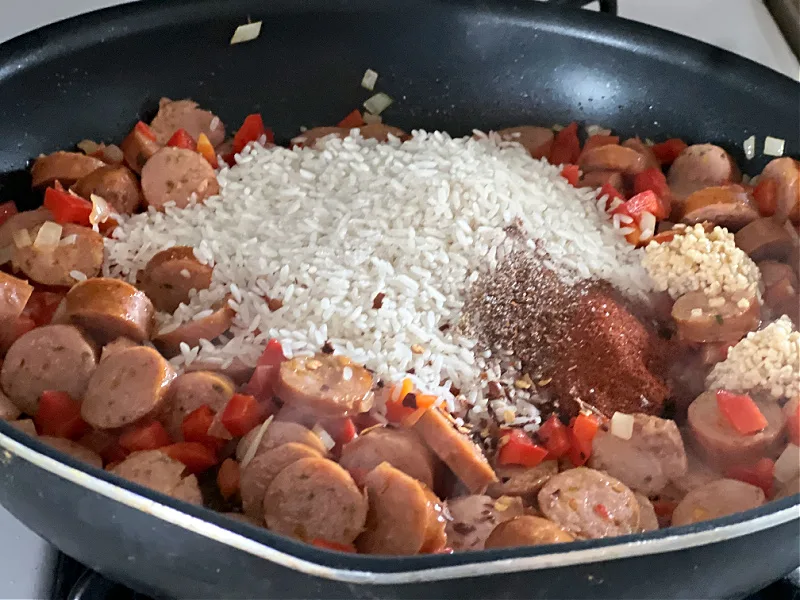 add rice and seasonings to the pan