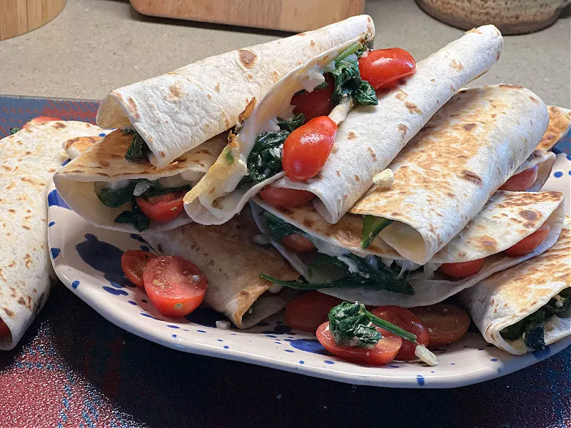 plate of spinach tomato feta quesadillas