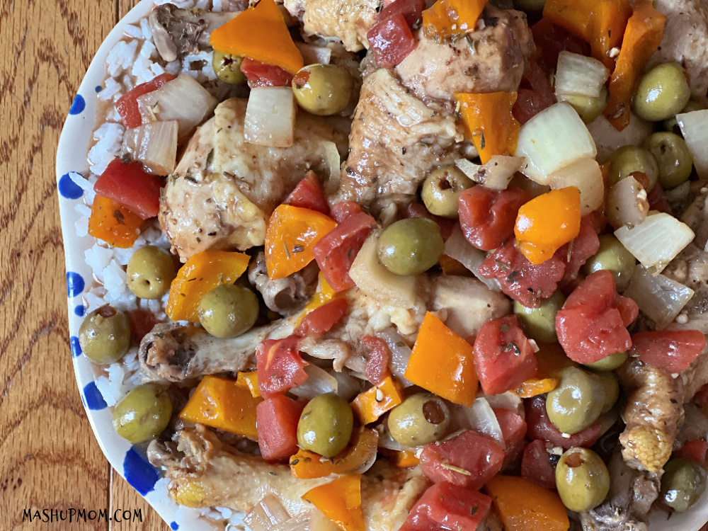 slow cooker mediterrean chicken on a plate with rice