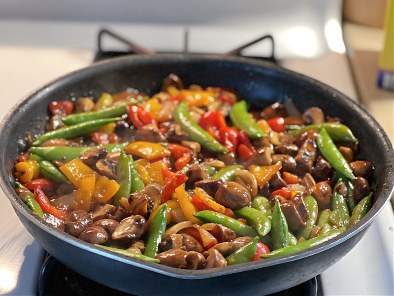 vegetarian stir fry in a pan on the stove
