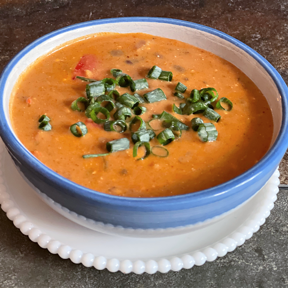 bowl of soup made with pumpkin chipotle pasta sauce