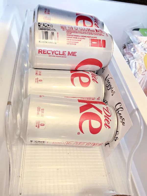 fridge bin holding diet coke