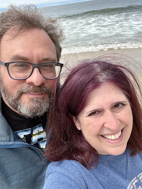 wearing a sweatshirt on the beach in half moon bay