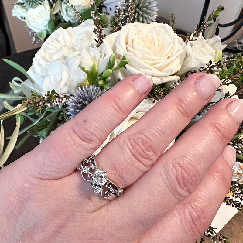 wedding ring with flowers in the background