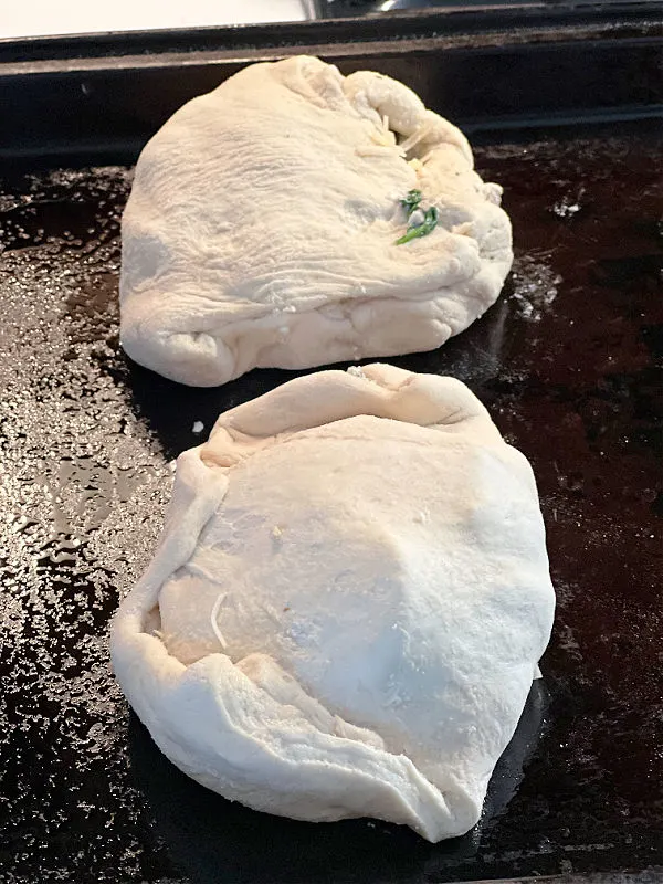 calzone on the baking sheet before cooking