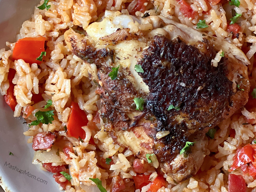 oven baked chicken on rice, with tomatoes and sweet peppers