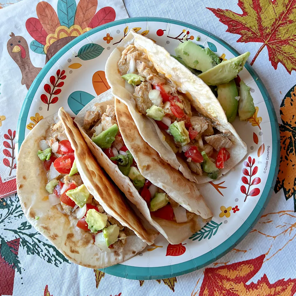 three turkey tacos on a plate