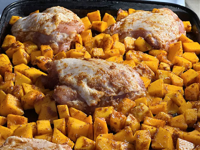 chicken and squash on the baking pan