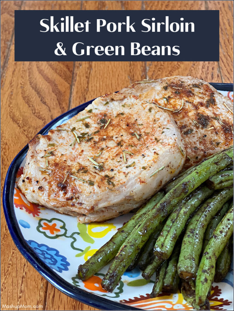 browned pork chops and seasoned green beans on a pretty plate