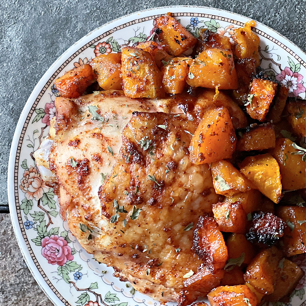 chicken and squash piled on a pretty plate
