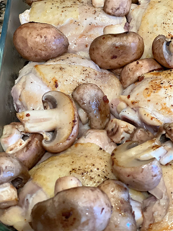 tuck mushrooms around the chicken