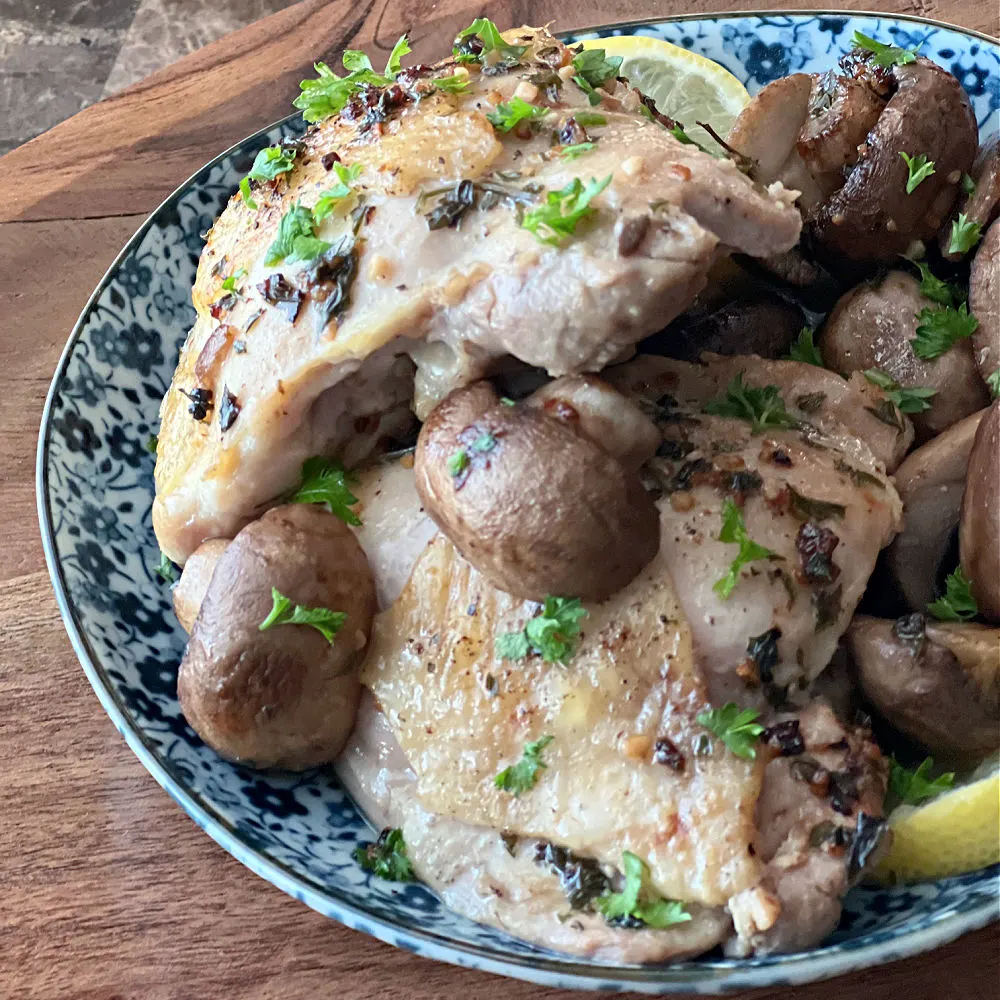 lemon chicken and mushrooms on a plate