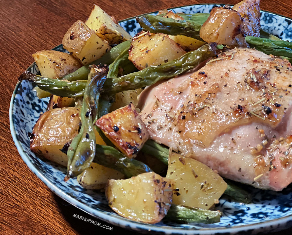 plated juicy chicken with potatoes and green beans