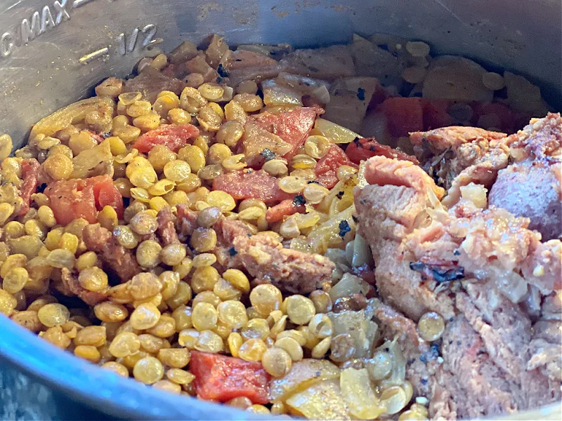 cooked lentils and ham in the pot