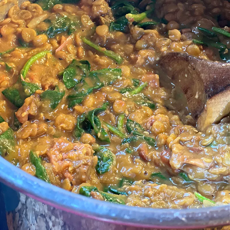 wilt spinach into the lentil stew