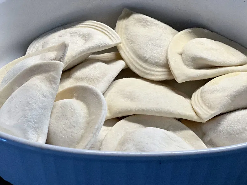 add frozen pierogies to the baking dish