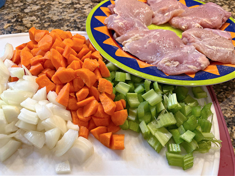 chicken and chopped carrots, celery, and onion