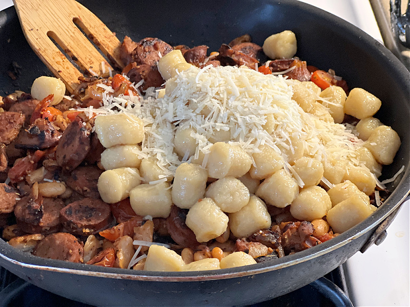 add the gnocchi and parmesan cheese to the pan