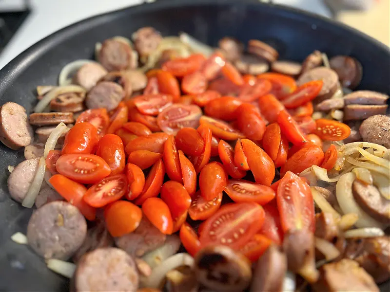 add the tomatoes to the skillet