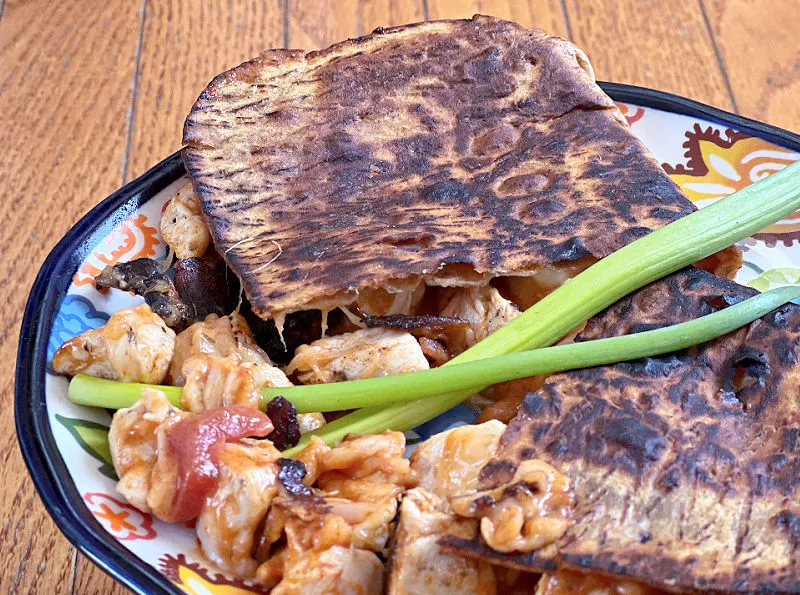 chicken tikka masala grilled cheese on a plate