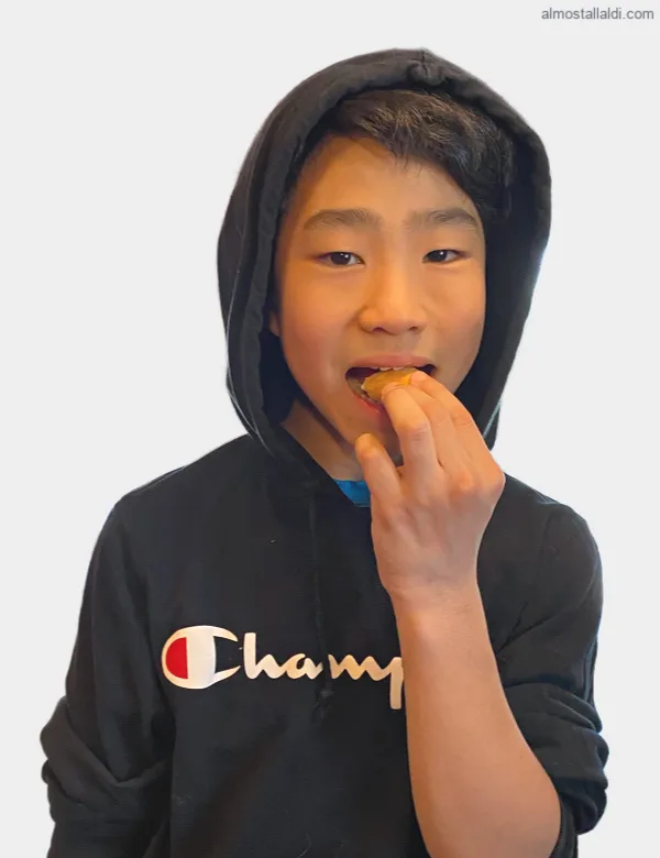 middle school guy eating a naanpanada
