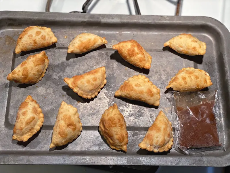 mini naanpanadas on a toaster tray