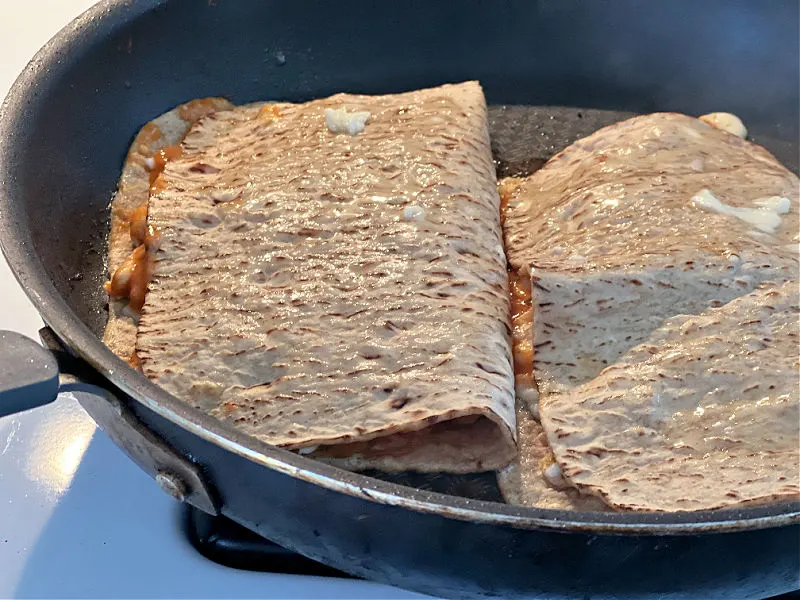 butter the wraps in the skillet