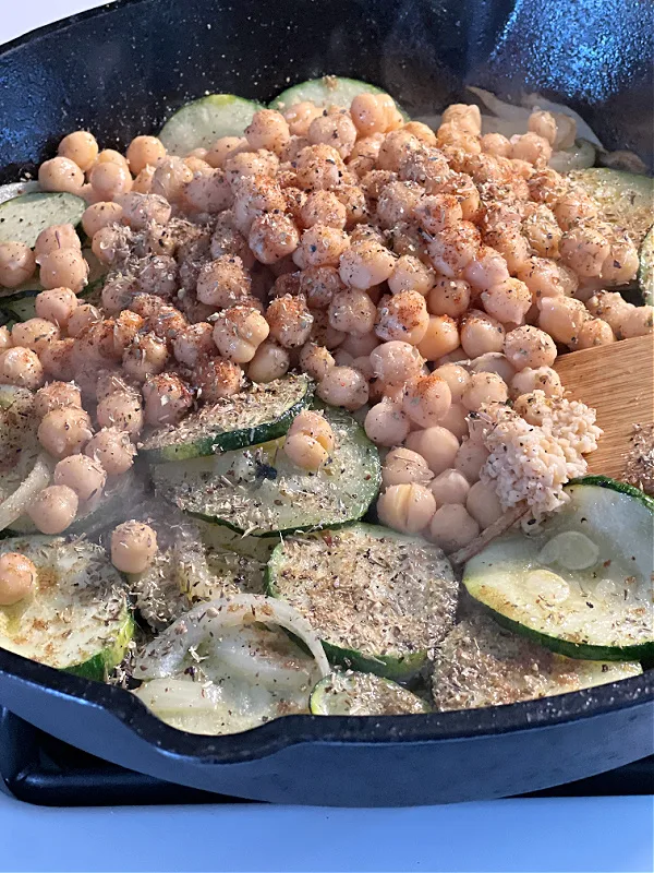 chickpeas garlic and seasonings in the pan