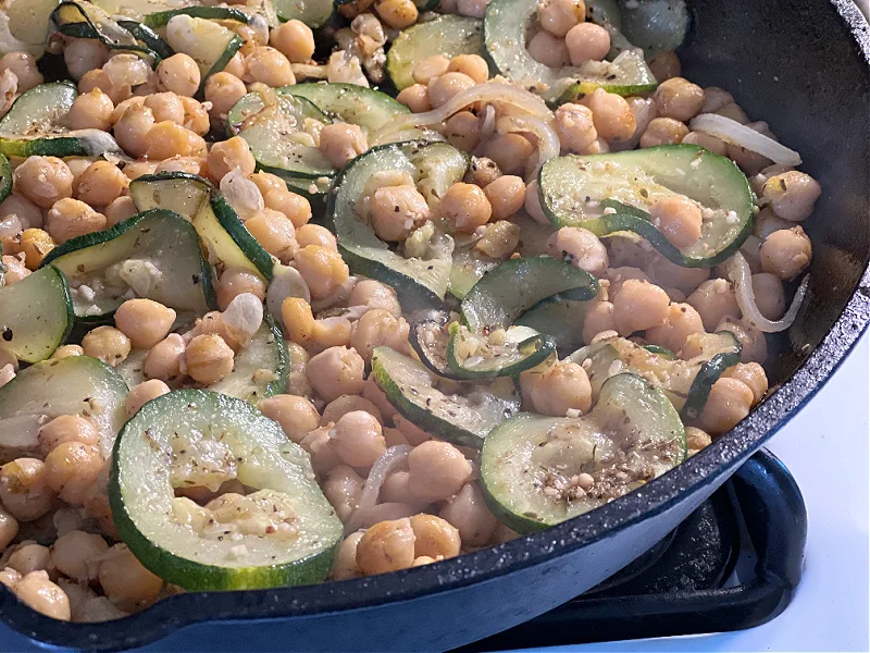 softened zucchini and chickpeas in the pan