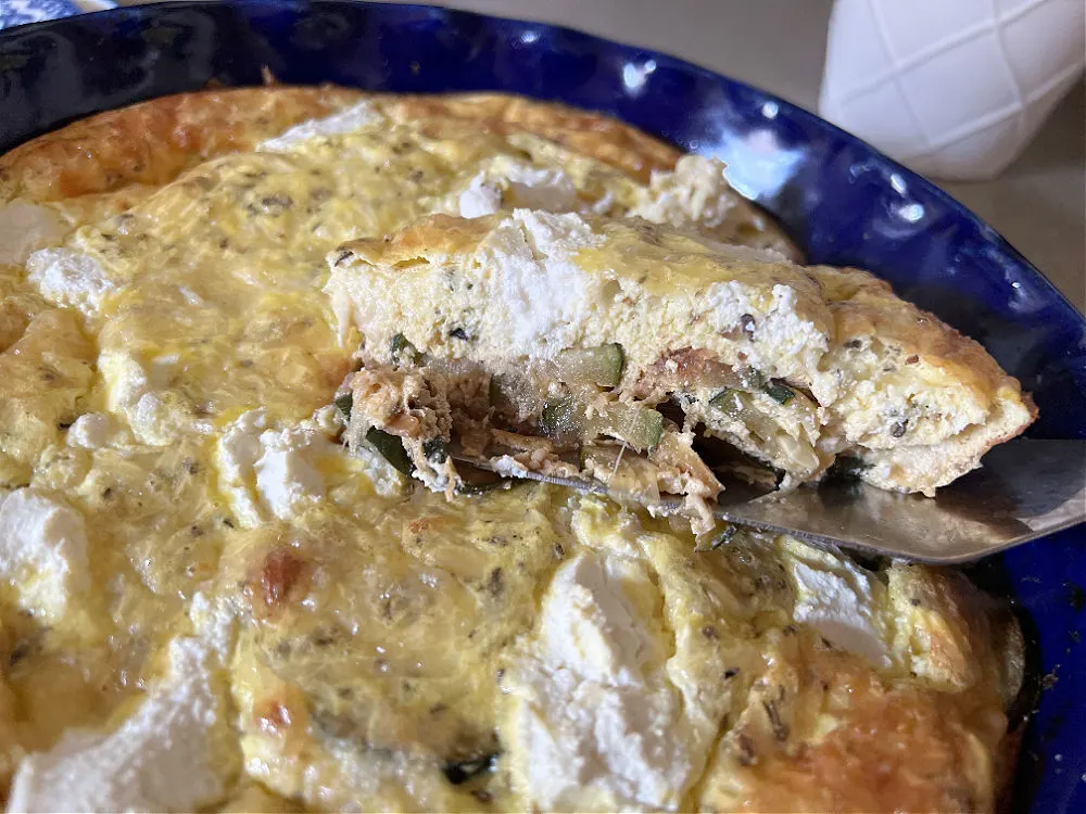 slicing the zucchini ricotta frittata 