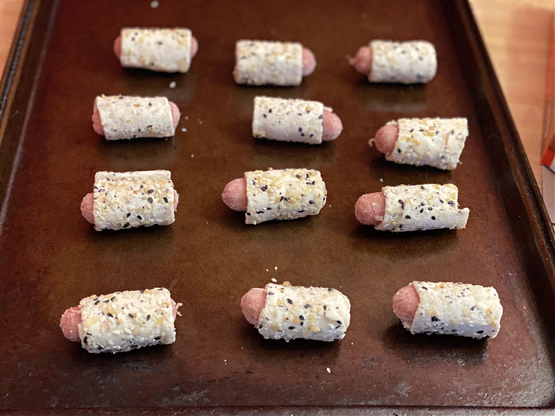 bagel dogs on a cookie sheet